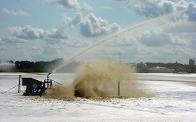 Lagoon aerator includes water cannon for foam suppression